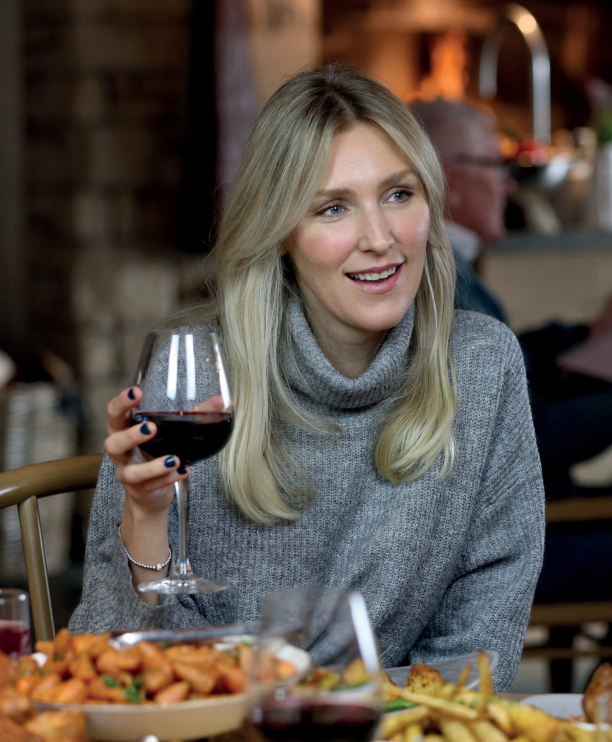 Woman enjoying a glass of red wine